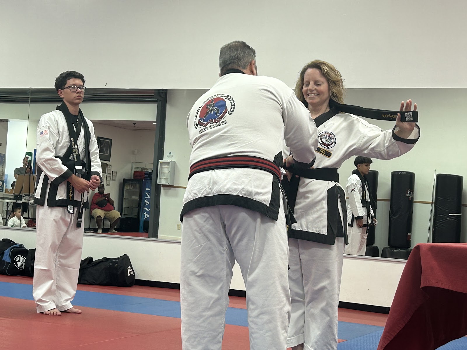 A The One Hour student smiling proudly after class at Roman's Shin Karate in Hamilton
